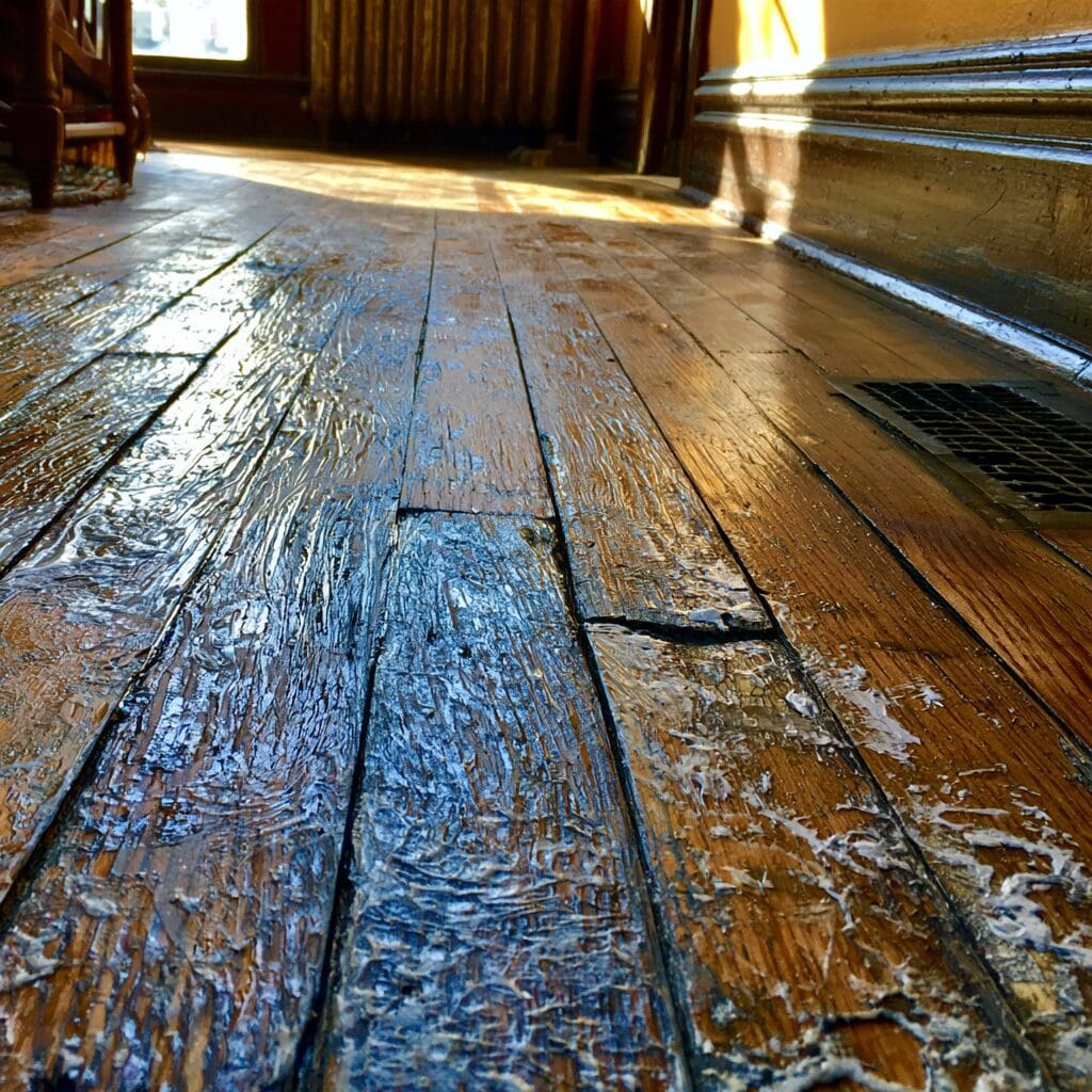 carpet glue on hardwood floor
